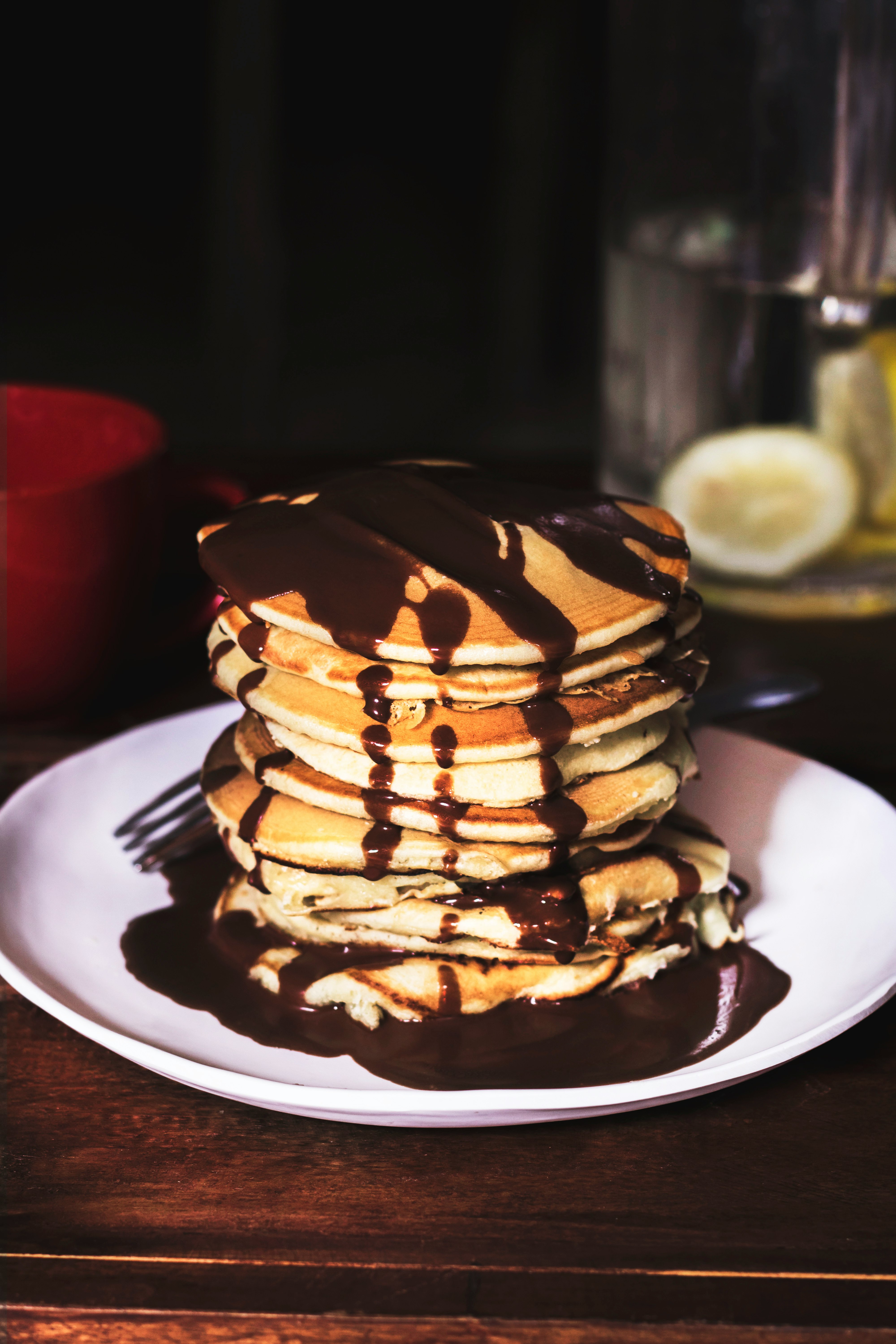 pancake on round plate with chocolate syrup